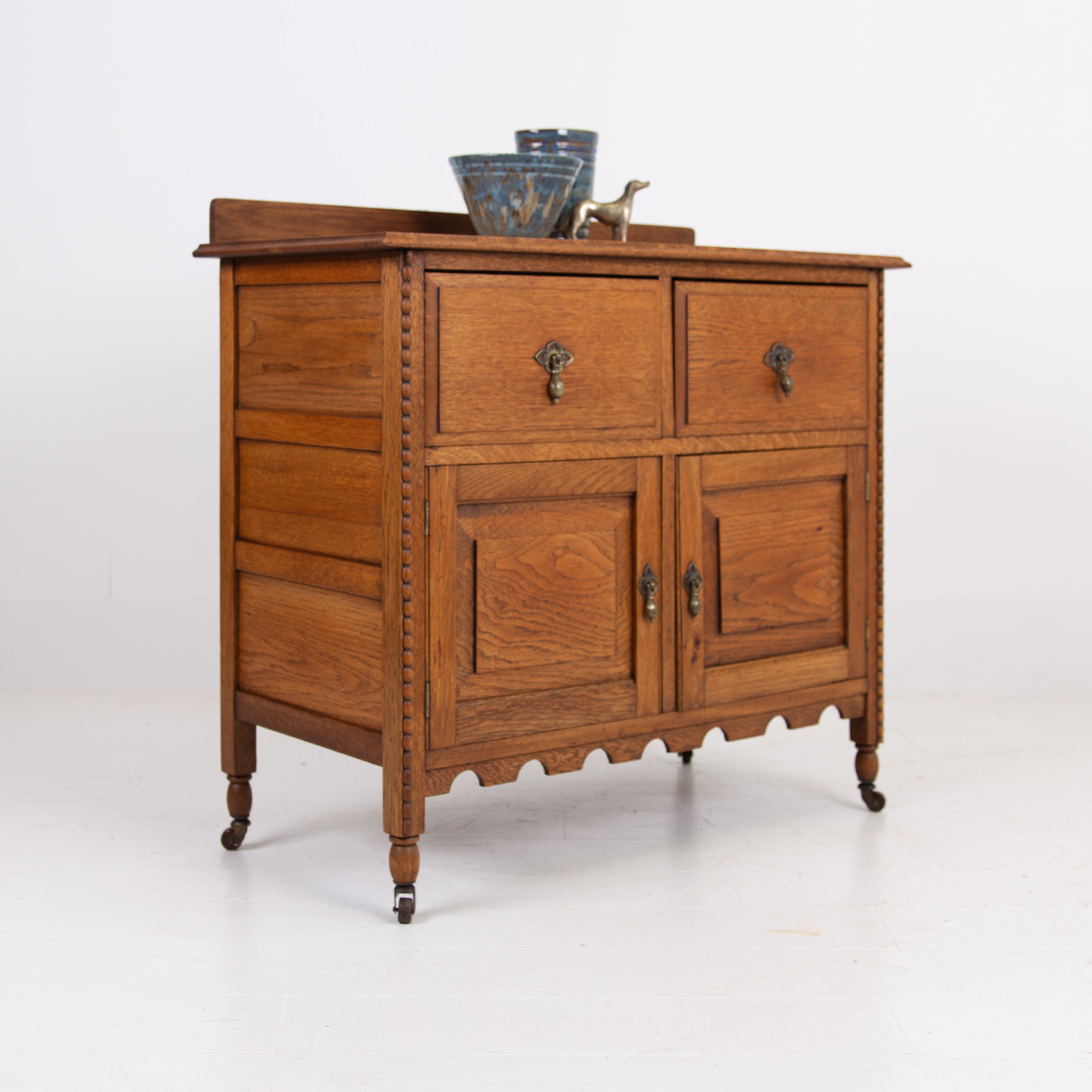 A Charming Oak Cabinet With Drawers C1910