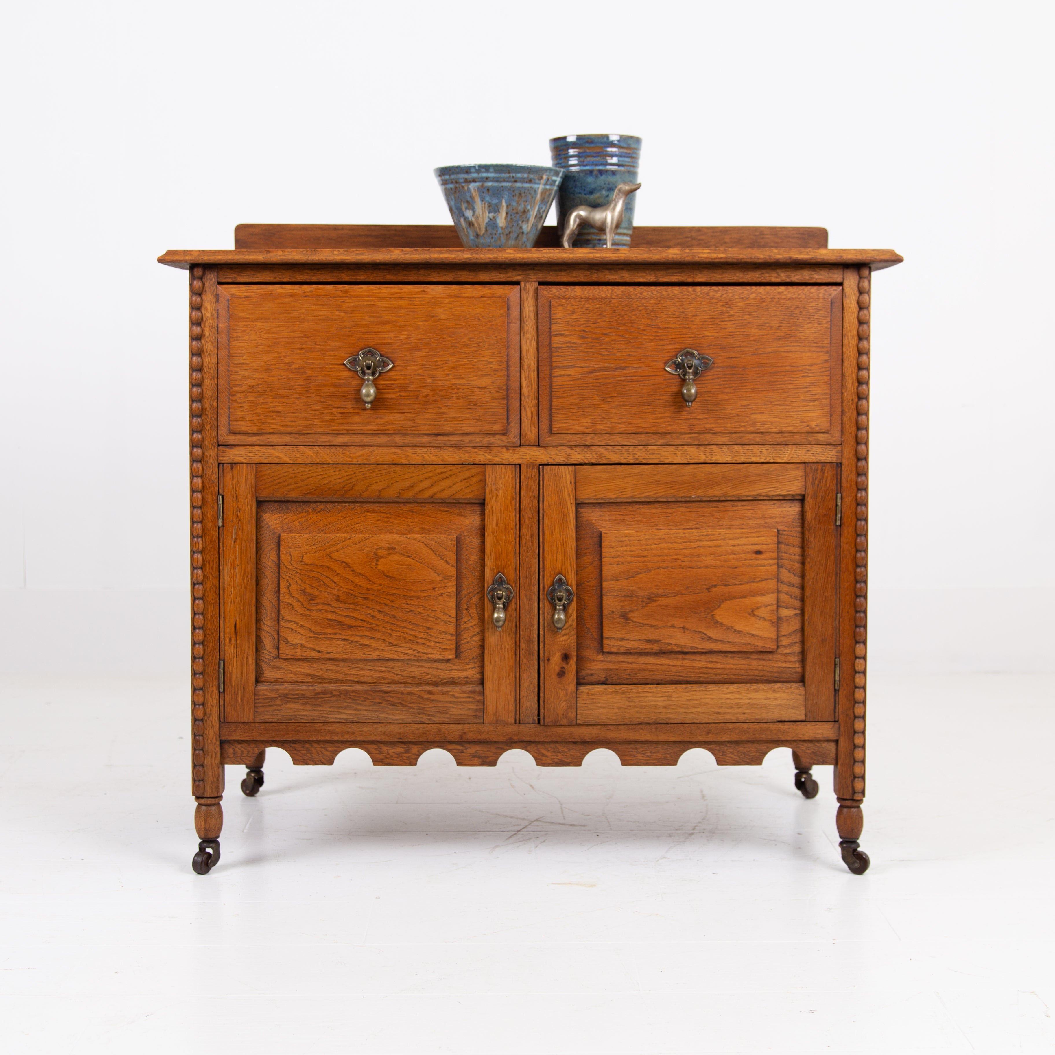 A Charming Oak Cabinet With Drawers C1910