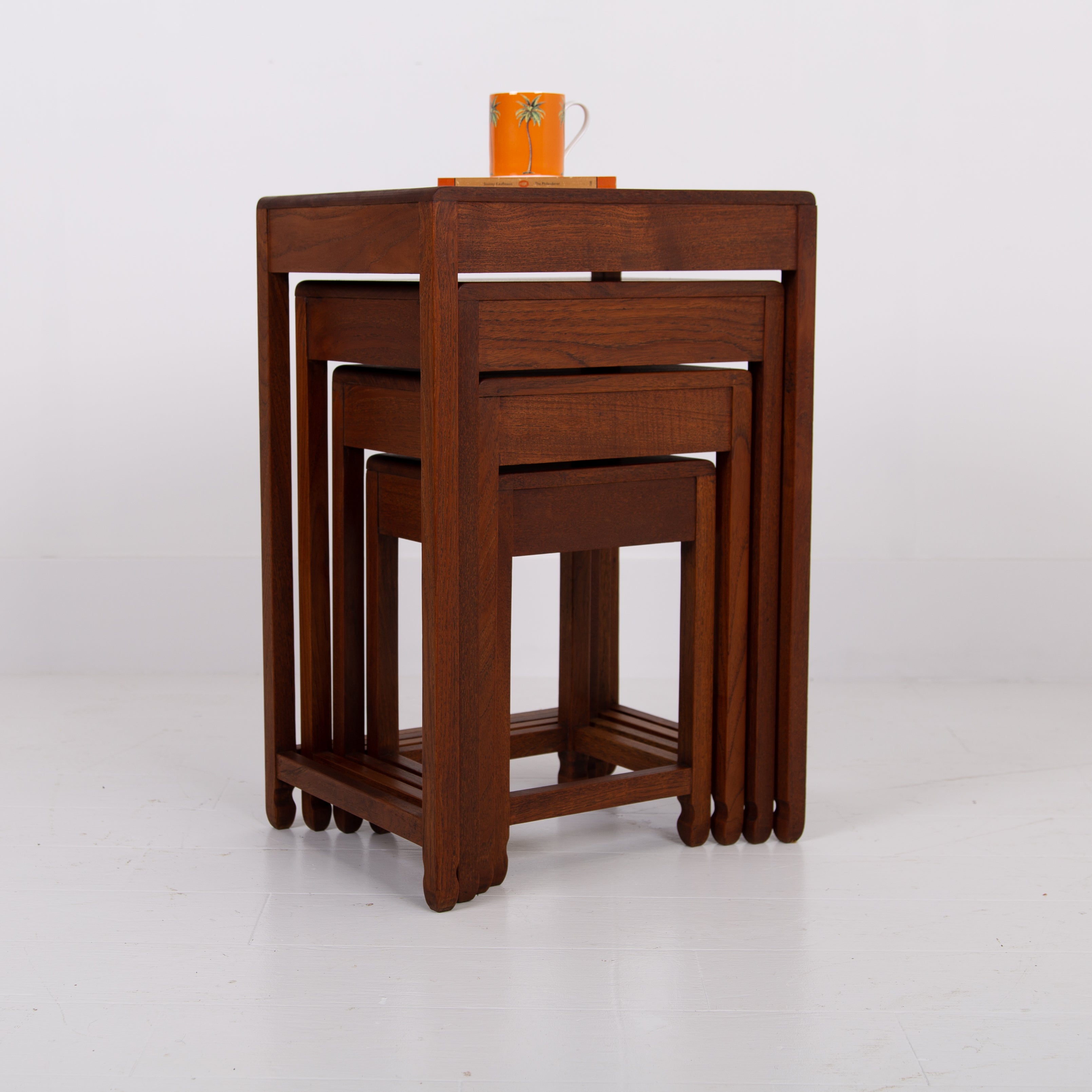 A Modernist Art Deco Nest of Four Side Tables in Teak