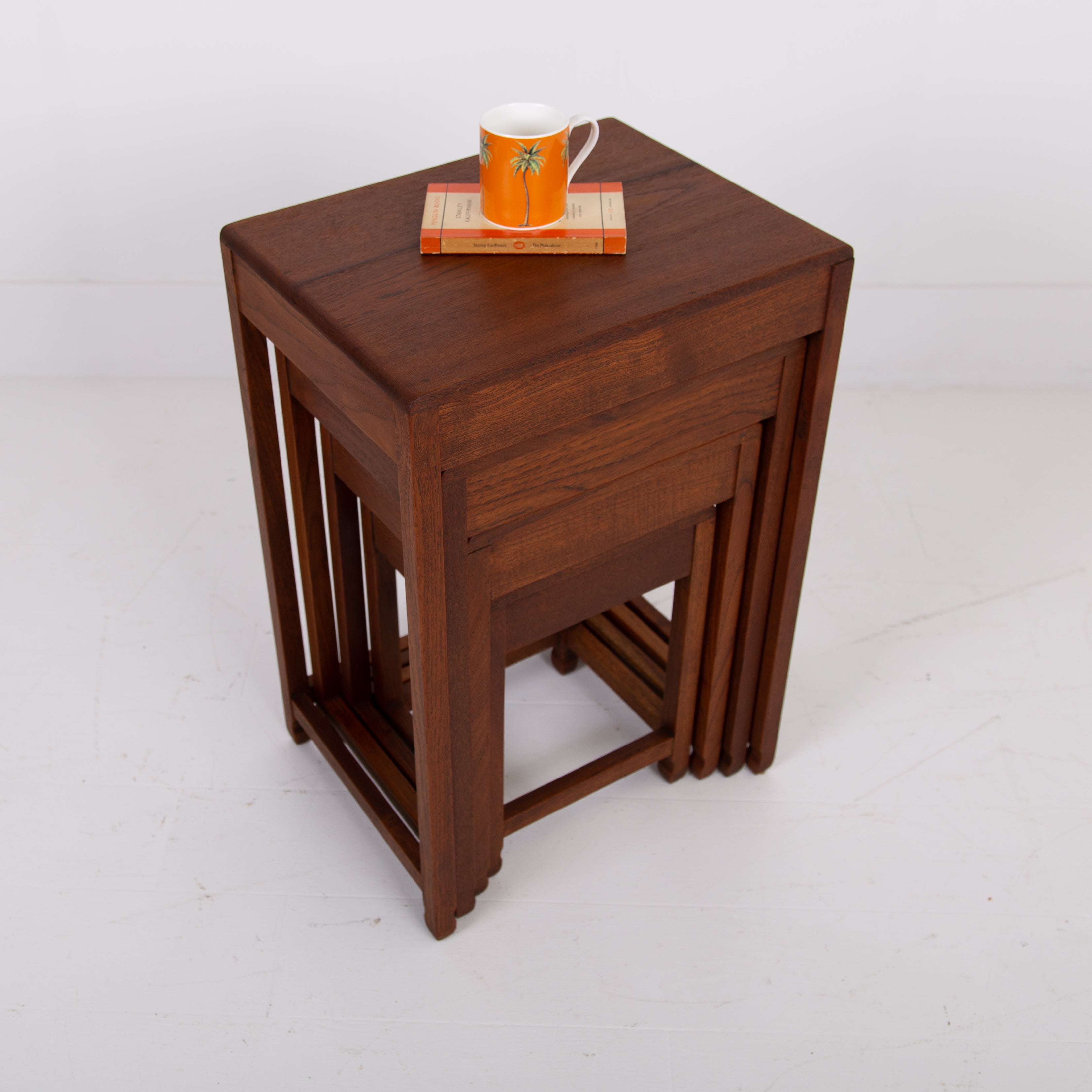 A Modernist Art Deco Nest of Four Side Tables in Teak