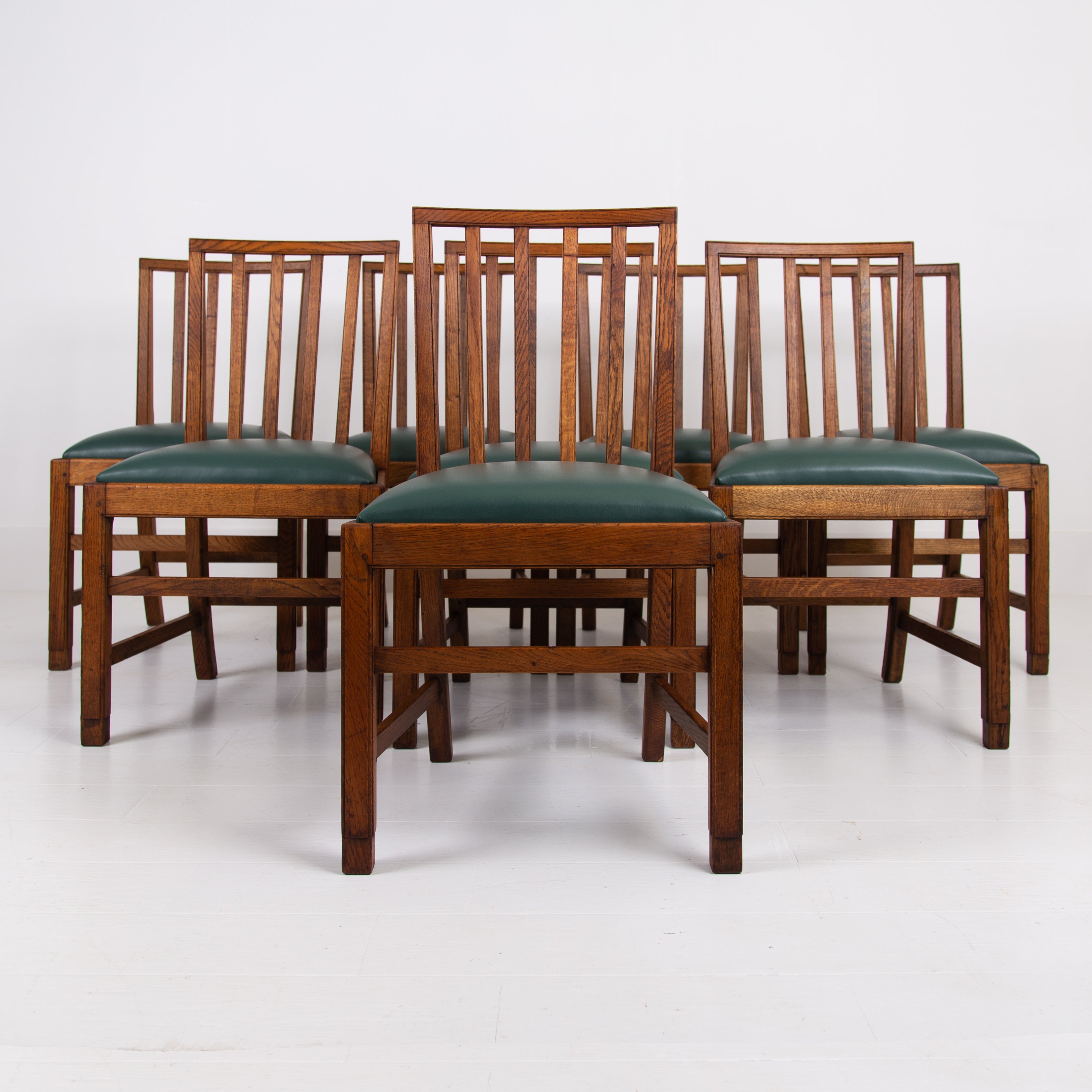 Set of 8 Gordon Russell Arts & Crafts Golden Oak Chairs 1930s