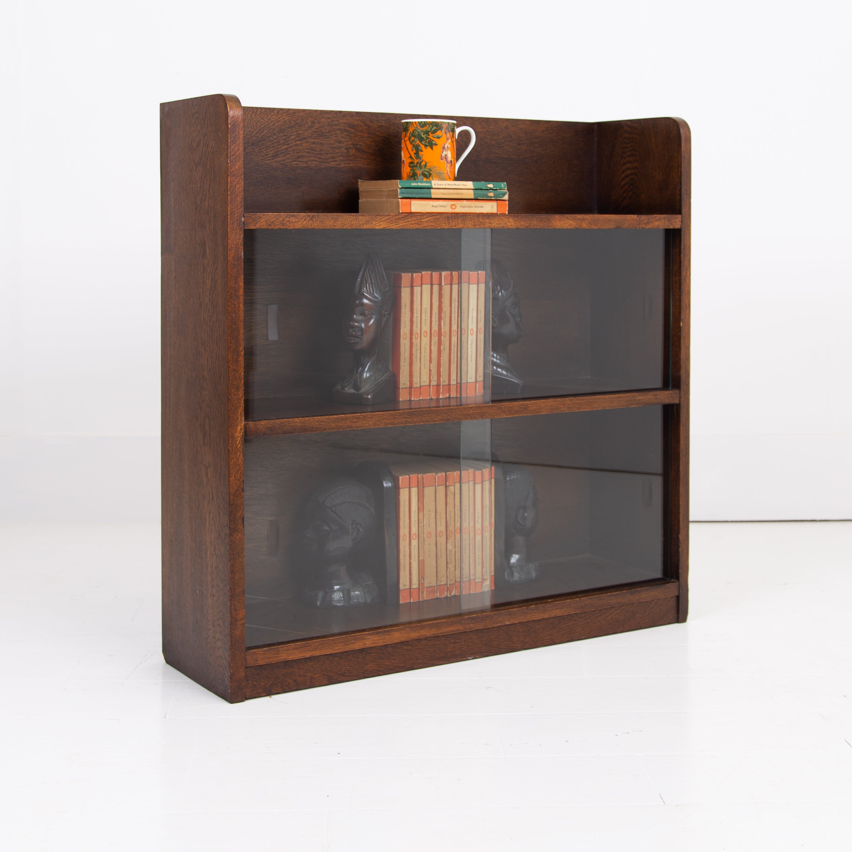 A British Oak Bookcase With Sliding Glass Doors C1940s