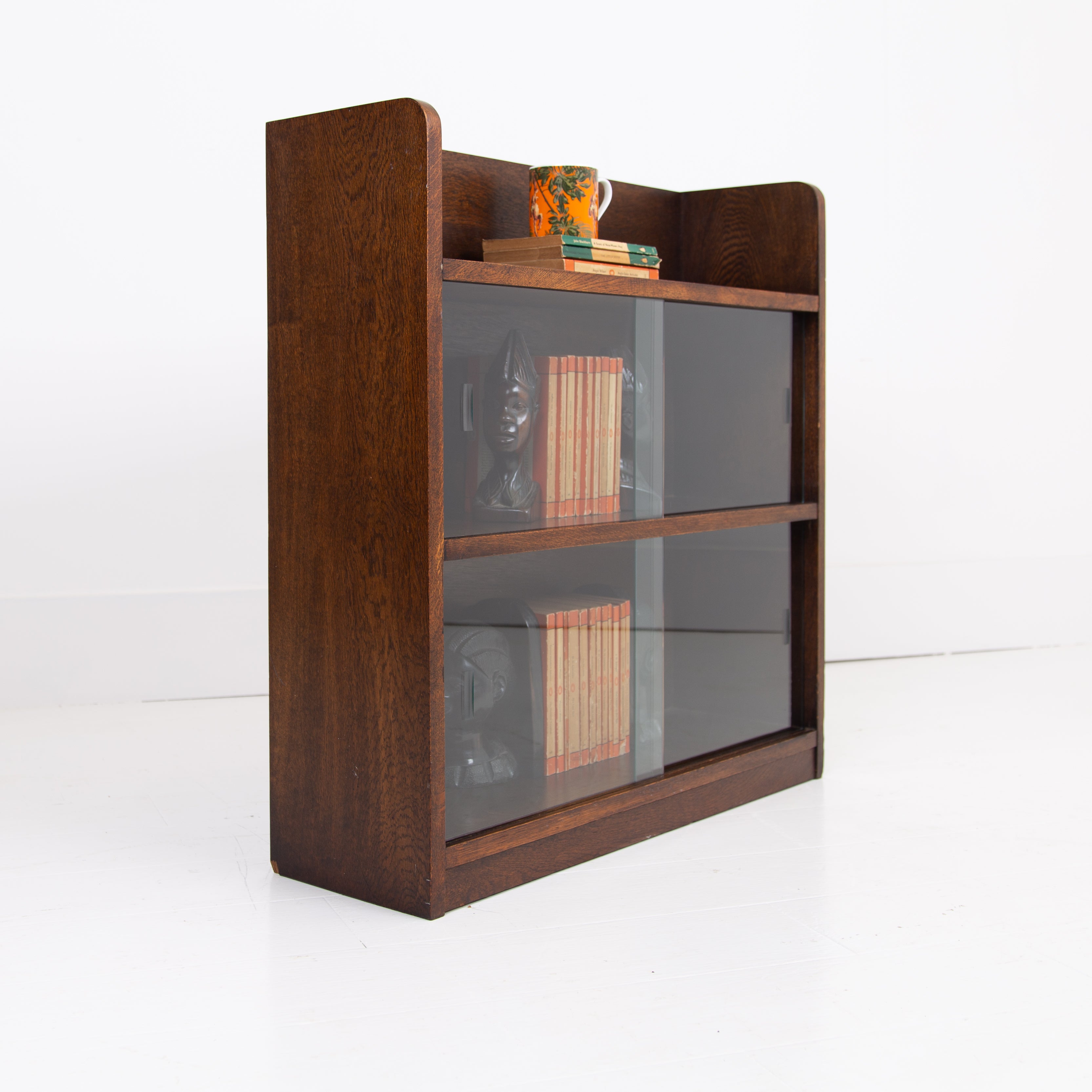 A British Oak Bookcase With Sliding Glass Doors C1940s